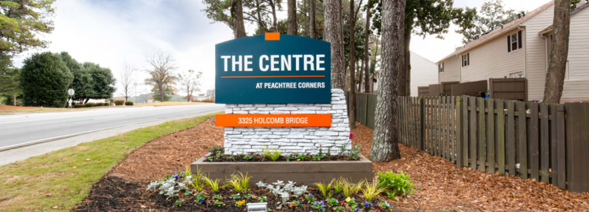 The image shows a sign for  The Centre  with the additional text  An Adult Day Care Facility.